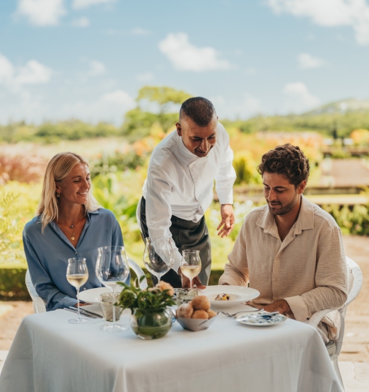 Couple enjoying a gourmet lunch experience at Le Château de Bel Ombre