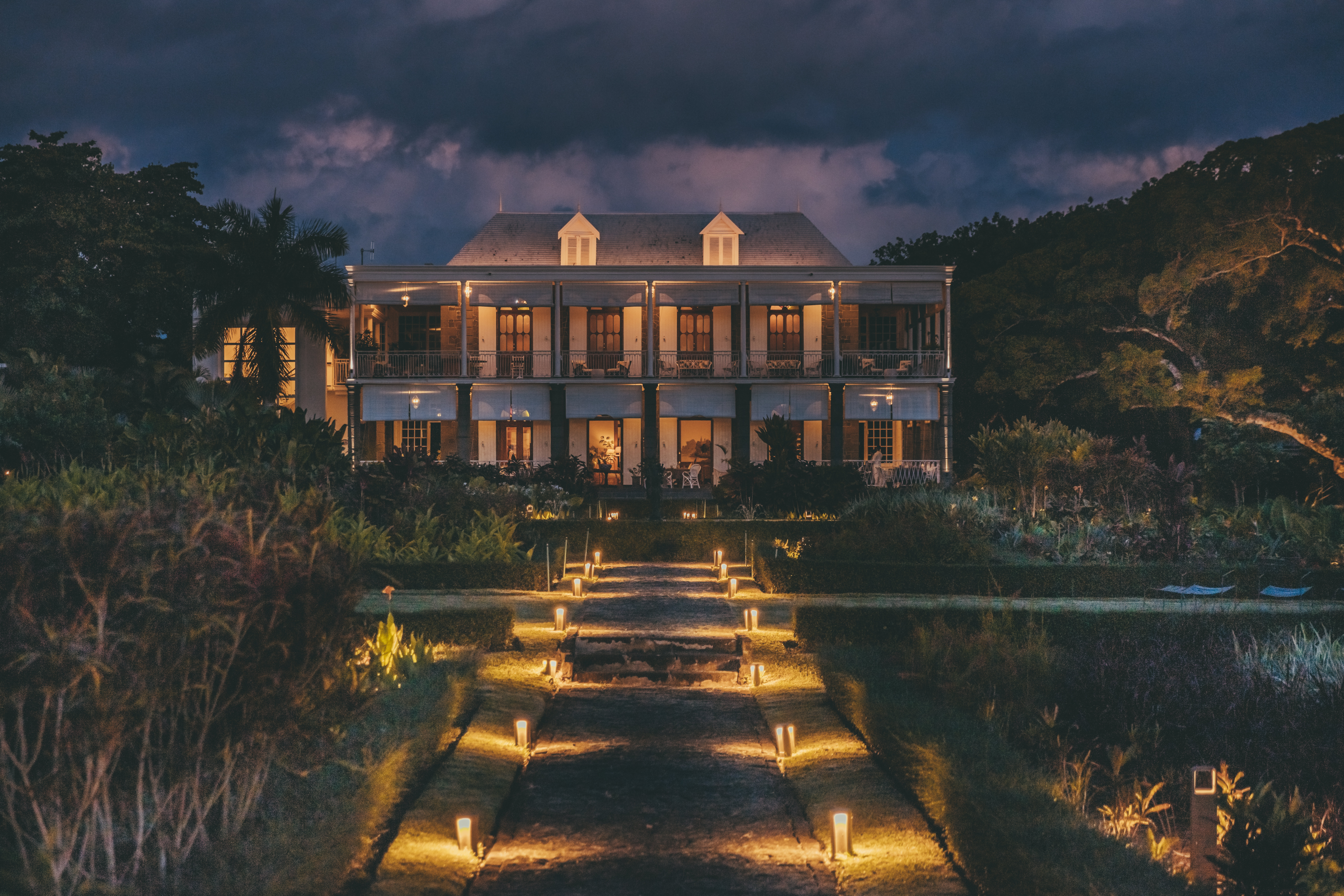 Bright view with Exterior Lights over Le Château de Bel Ombre at Night 