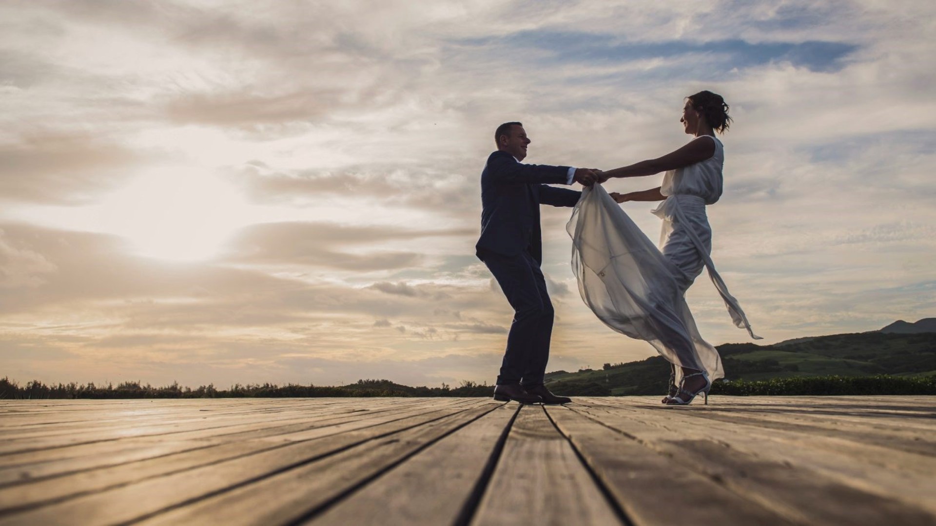 Happily Married Couple dancing on the outdoor deck at Le Château de Bel Ombre, Mauritius